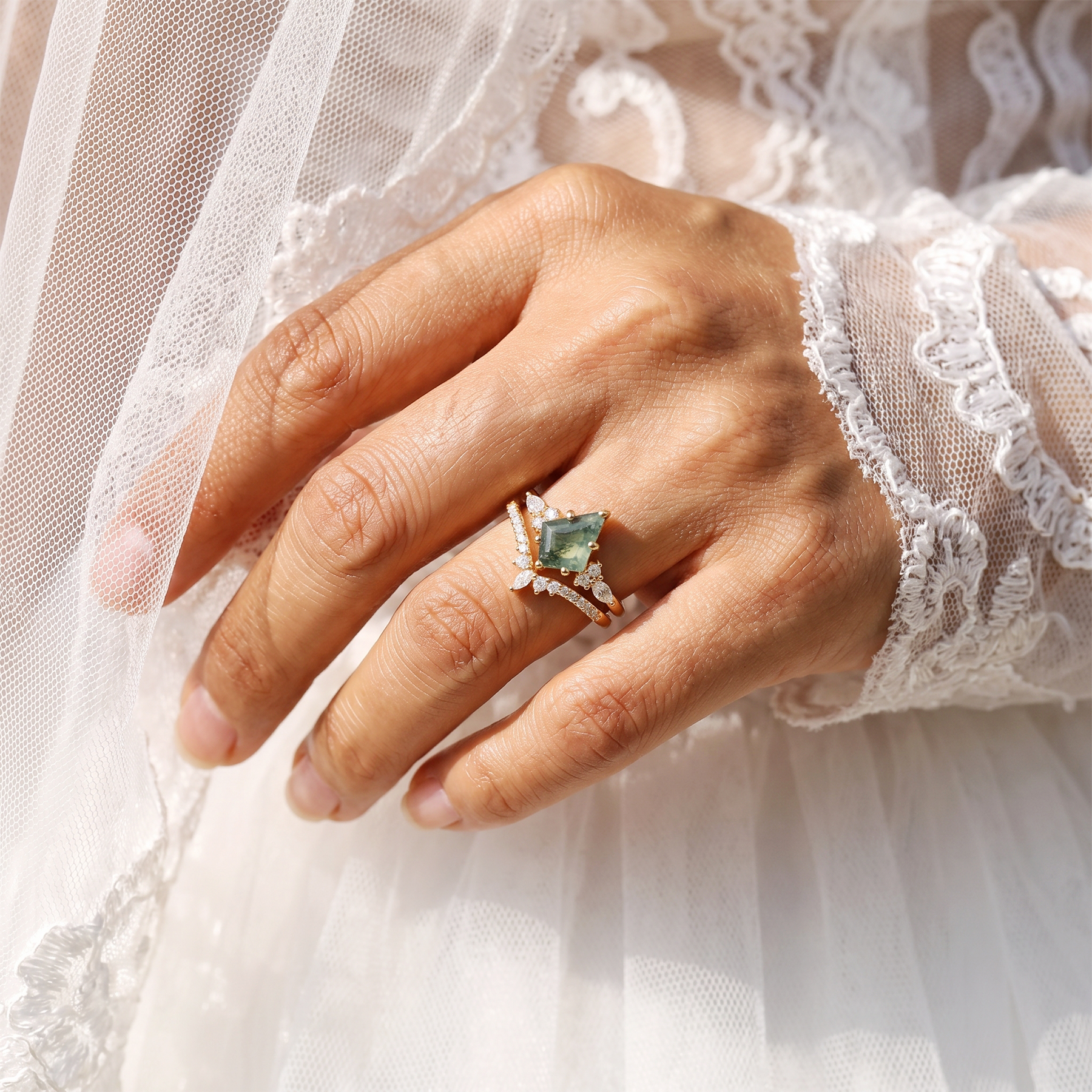 Gem's Beauty moss agate ring worn on a hand